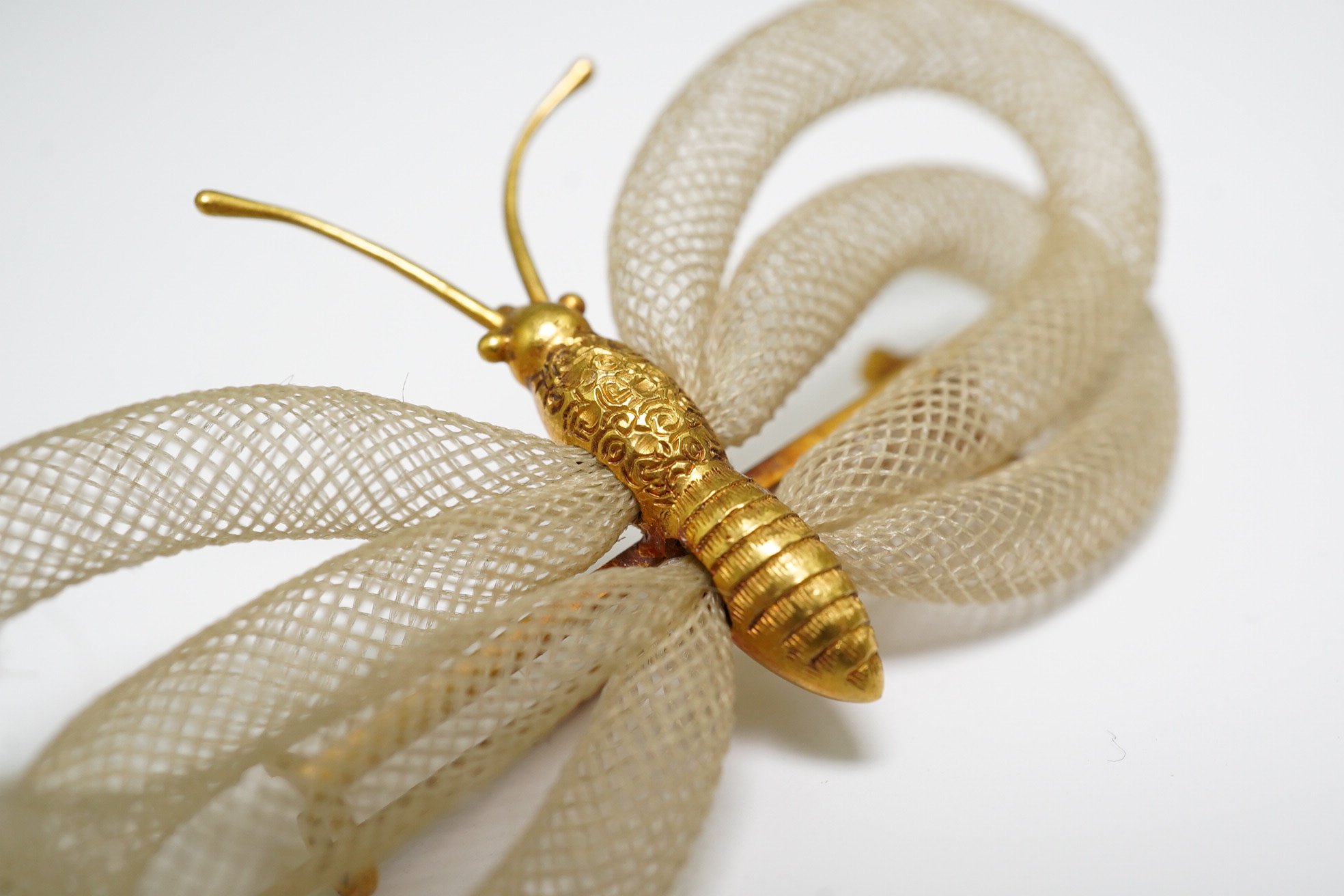 Antoni Forrer (1802/3-1889), 'Artiste en Cheveux', 136 Regent Street, London. A pair of gold mounted hairwork drop earrings and a butterfly brooch